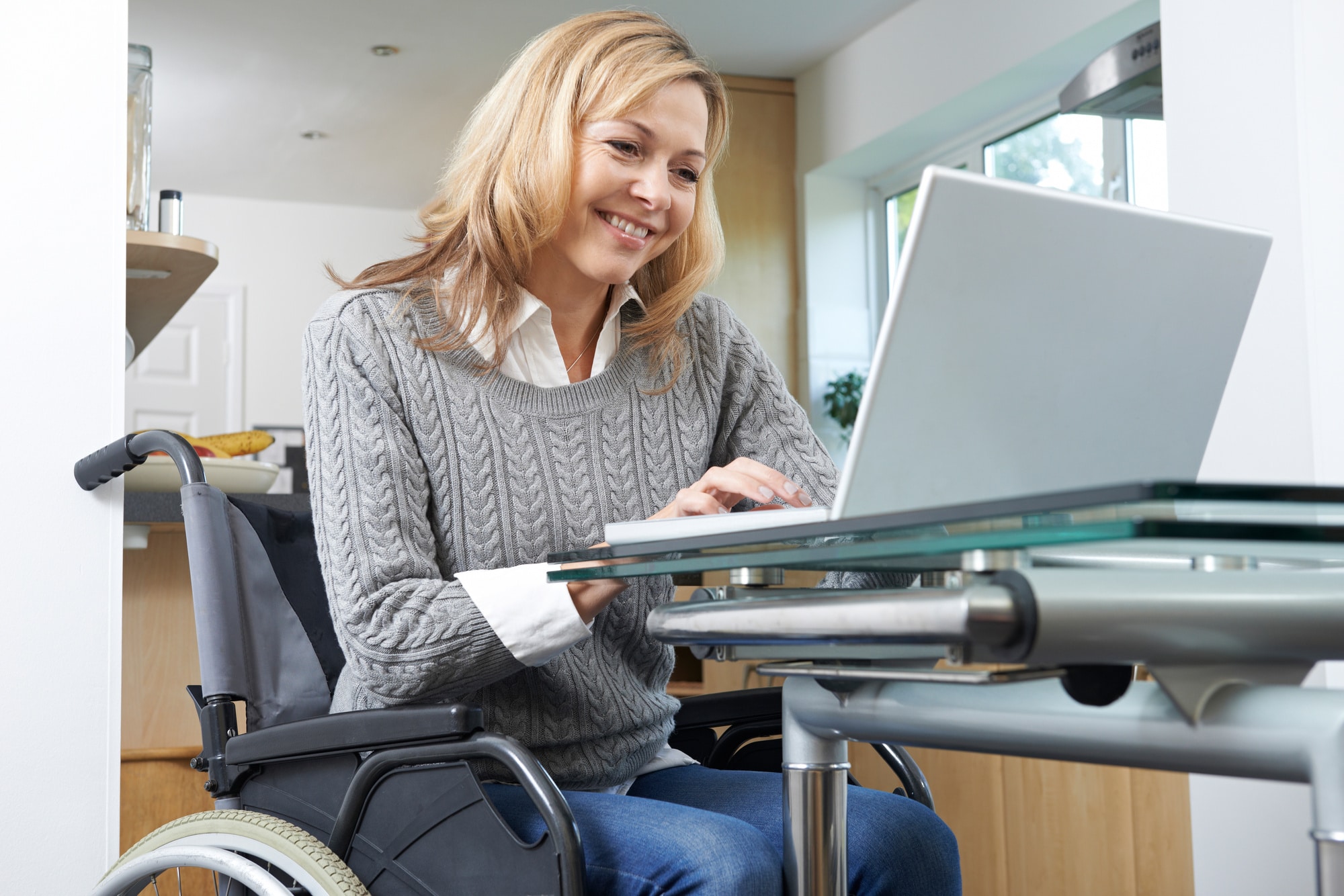 woman in wheelchair blogging